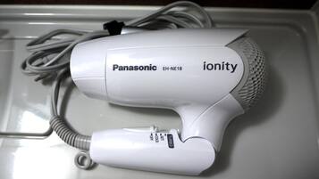A Panasonic ionity hair dryer with a cord and a power switch.