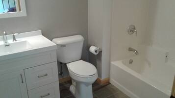 Combined shower/tub, hair dryer, towels, soap