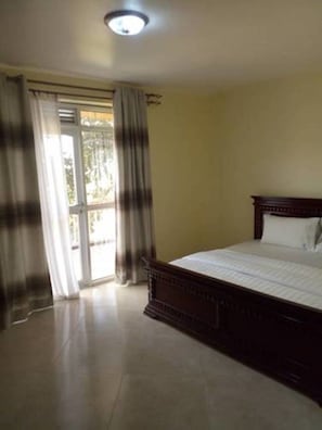 Deluxe Double Room, Balcony | Desk, laptop workspace, free WiFi, bed sheets - Court Lane Hotel (Masaka)