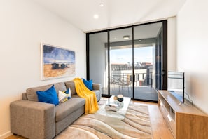 Apartment 1104 - beautiful and well located 1 bedroom | Living room | Flat-screen TV, Netflix, streaming services - Sofun Apartment on Vulture St (South Brisbane)