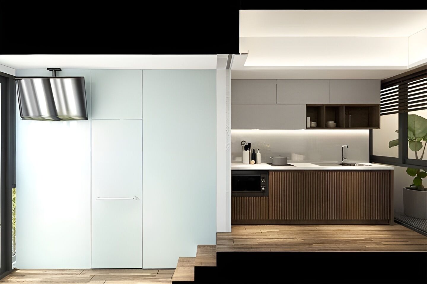 Una cocina moderna con horno empotrado, un lavamanos y encimera de madera.