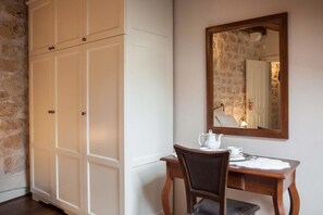 Traditional dining area with a wooden table, chair, and cabinet.