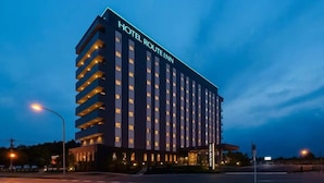 A multi-story hotel with a prominent sign reading "HOTEL ROUTE INN." - Hotel Route-Inn Kanuma Inter (Kanuma)