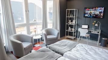 Desk, laptop workspace, blackout drapes, cribs/infant beds