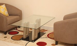 Junior Suite | Living area | 43-inch flat-screen TV with satellite channels, TV - Welcome Lodge (Ouagadougou)