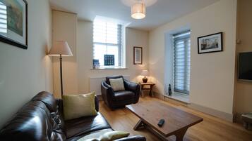 Deluxe Apartment, 1 Bedroom | Living area | Smart TV