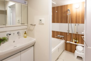 Separate tub and shower, free toiletries, hair dryer, slippers