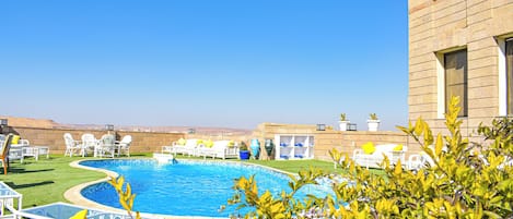 Outdoor pool, open 6:00 AM to 5:00 PM, pool umbrellas, sun loungers