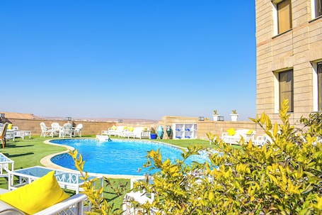 Outdoor pool, open 6:00 AM to 5:00 PM, pool umbrellas, sun loungers