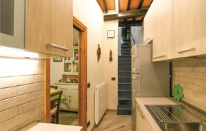 Fridge, stovetop, dishwasher, coffee/tea maker