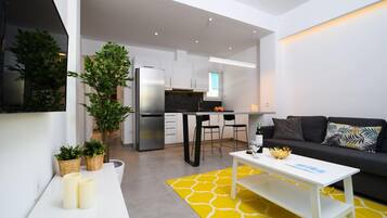 Apartment, 1 Bedroom | Living area | Flat-screen TV