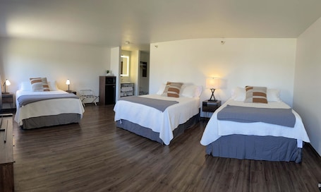 Deluxe Triple Room | Pillowtop beds, individually decorated, individually furnished. Eagle Peak Lodge & Cabins