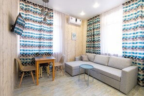 Apartemen | Area keluarga | TV layar datar