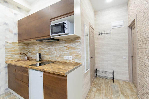 Fridge, microwave, electric kettle, high chair