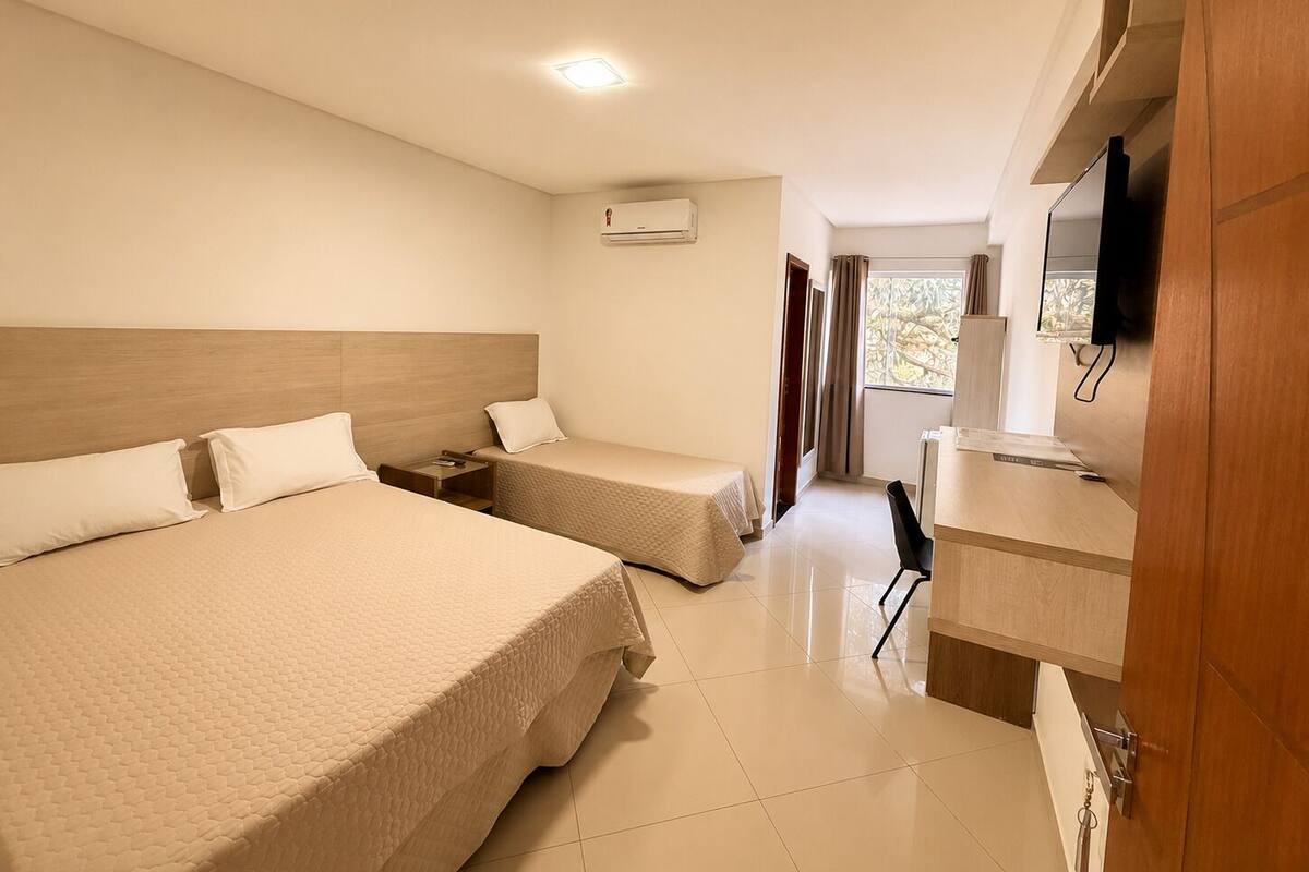 Deluxe Triple Room | Desk, laptop workspace, WiFi (free), bed sheets