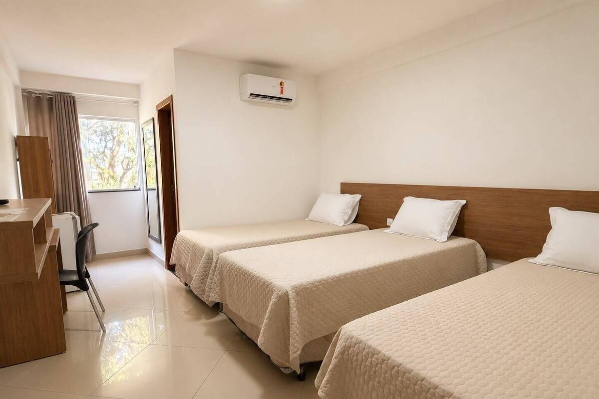 Deluxe Triple Room | Desk, laptop workspace, WiFi (free), bed sheets
