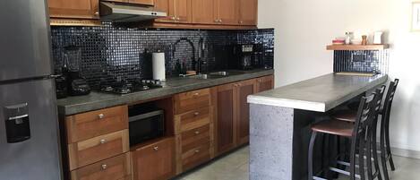 Fridge, microwave, stovetop, coffee/tea maker