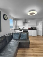 10 Apartment with Sea View: Loft Type 3rd Floor (plus 1 free baby) | Living area | 55-inch flat-screen TV with digital channels, Smart TV, Netflix