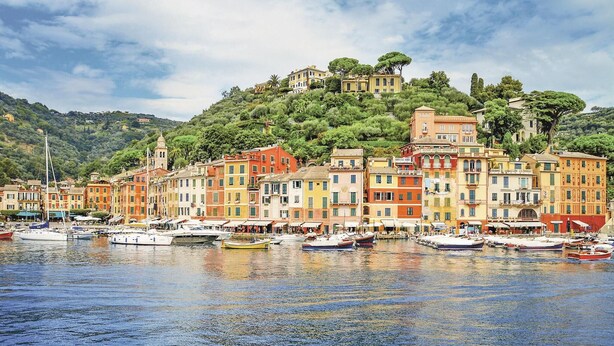A coastal town with colorful buildings and boats docked along the waterfront. - S. Rocco dimora tra ulivi e M. (Zoagli)