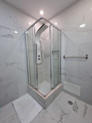 Shower, hair dryer, towels, soap