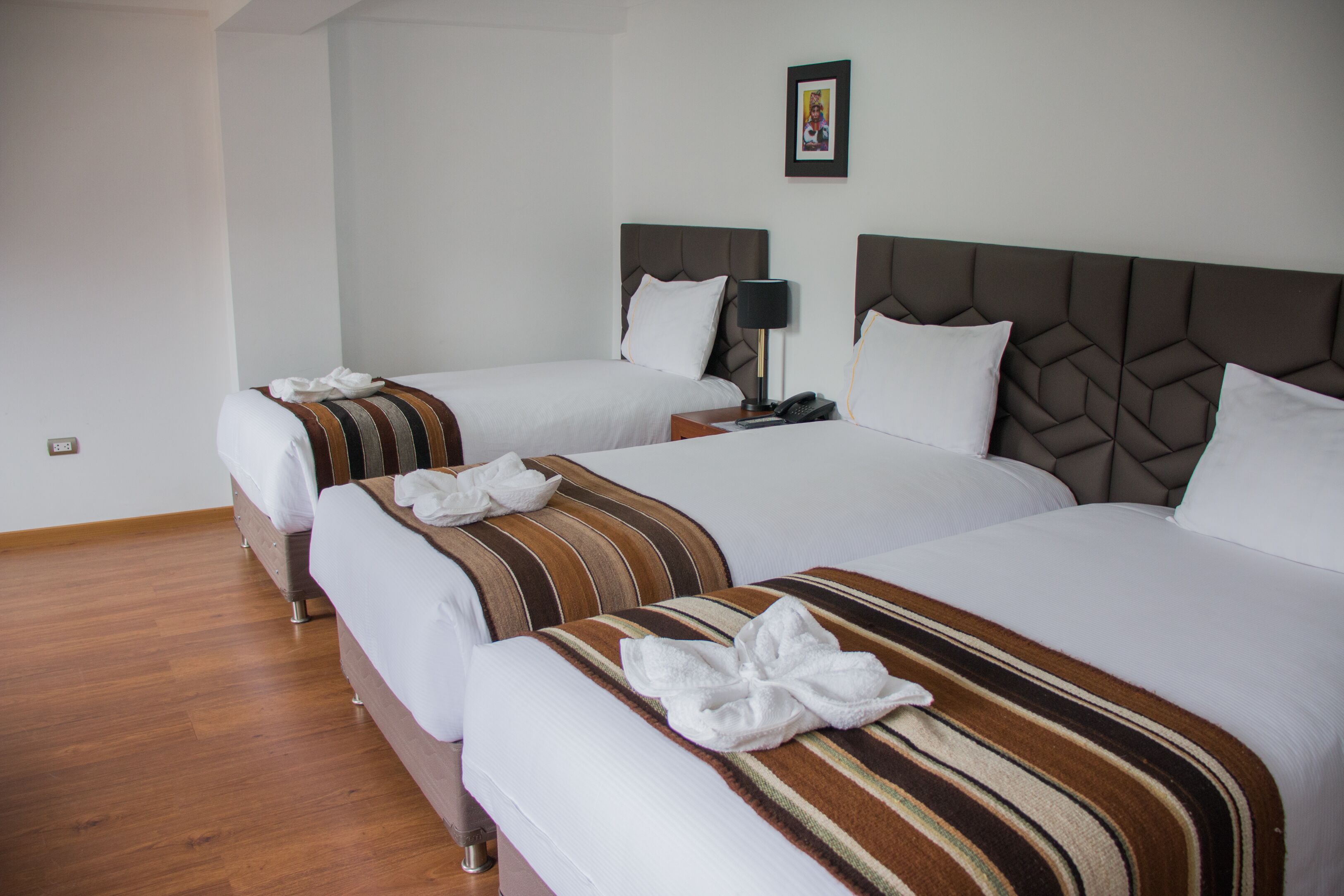 traditional triple room | frette italian sheets, premium bedding, down duvets, select comfort beds