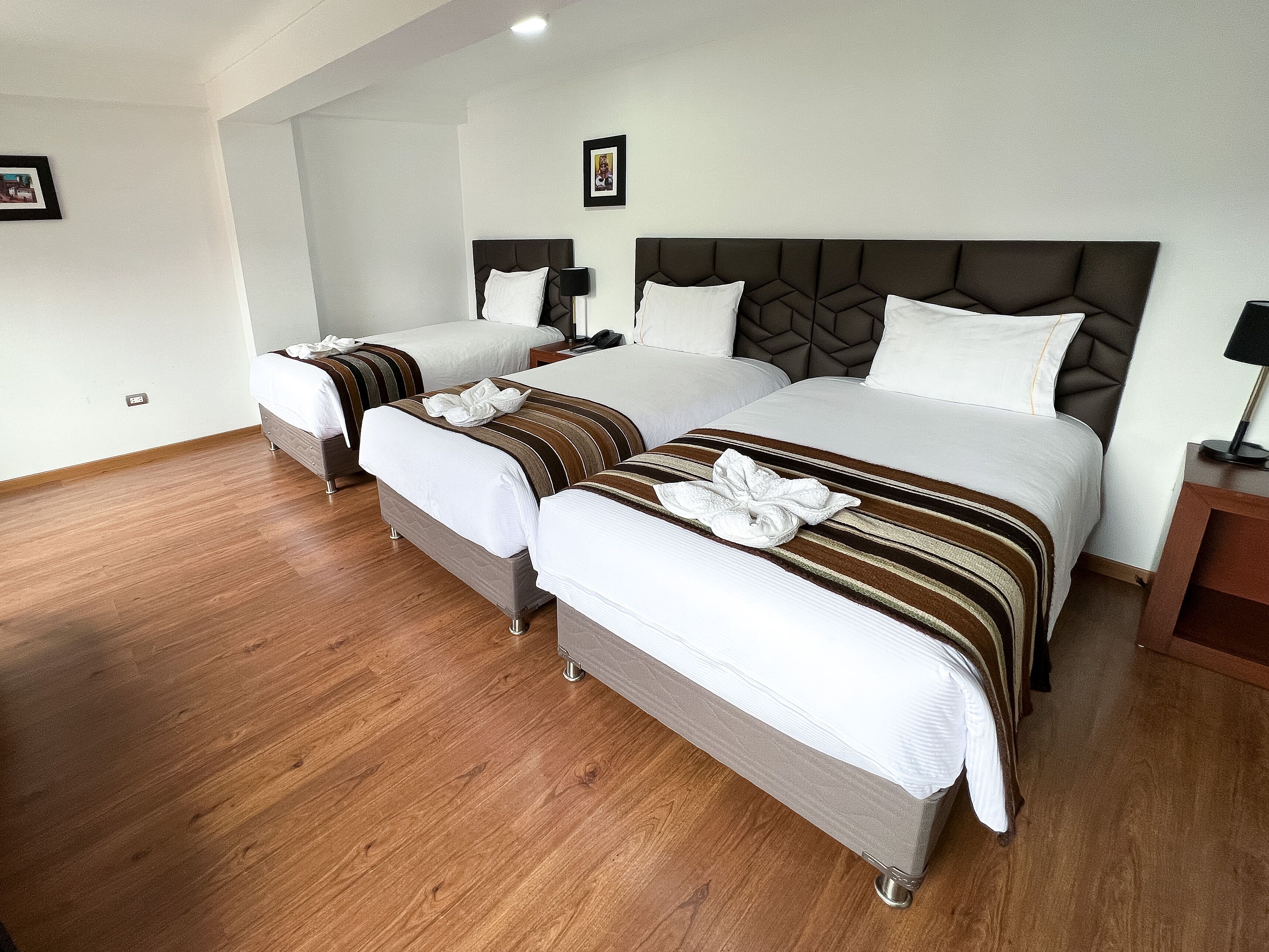 traditional triple room | frette italian sheets, premium bedding, down duvets, select comfort beds