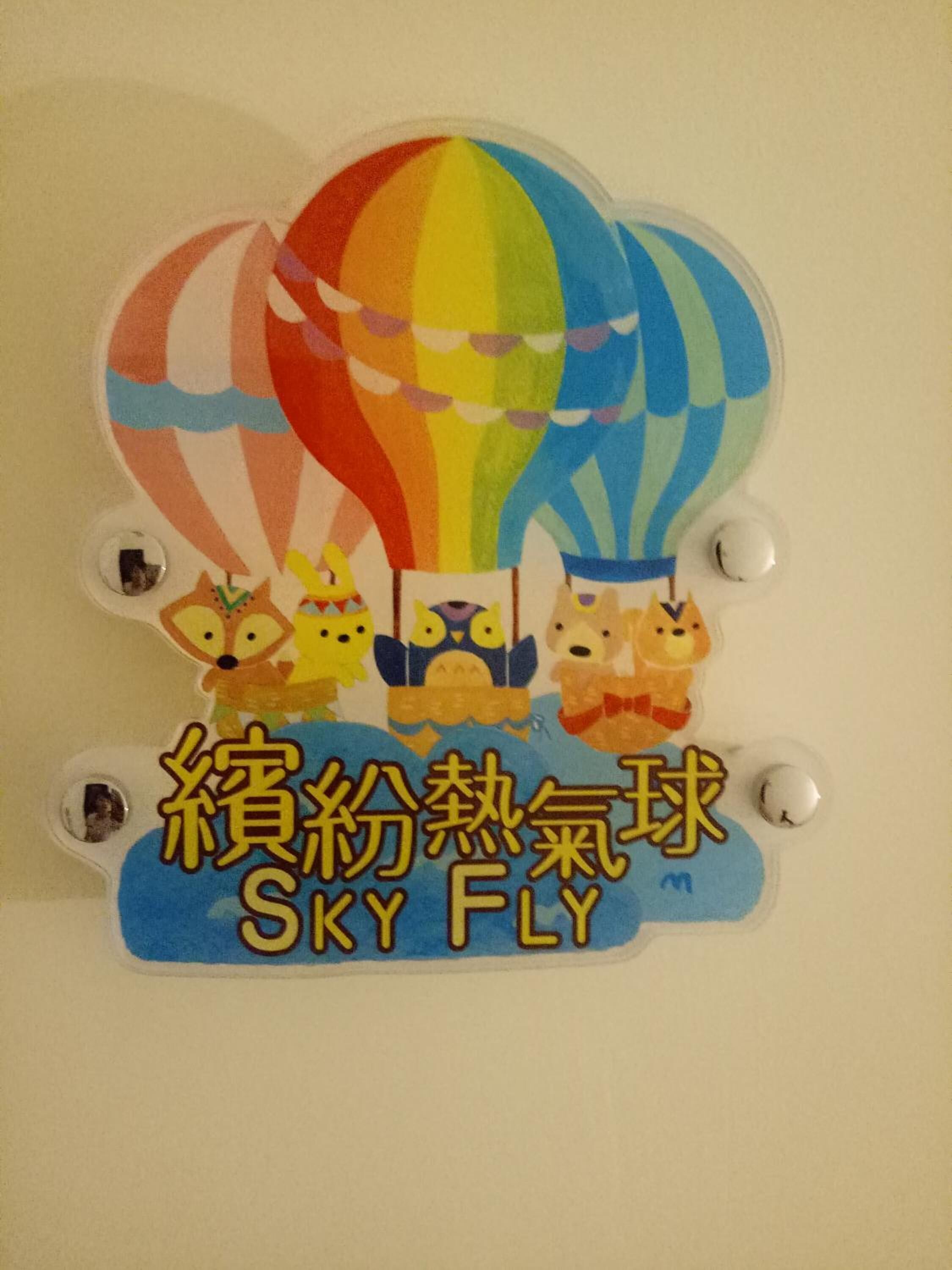 A wall decoration with hot air balloons and cartoon characters.