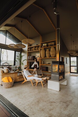 Safari Villa 10 (4 Adults, 2 Kids sleeper) | Living area | 32-inch flat-screen TV with satellite channels, TV, fireplace - Buff & Fellow Eco Cabins (George)