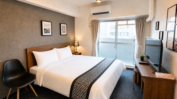 A hotel room with a bed, a desk, a chair, a TV, and a window with curtains. - COCO Fukuoka Chiyo (Fukuoka)