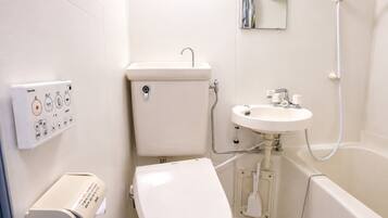 Combined shower/tub, free toiletries, hair dryer, slippers