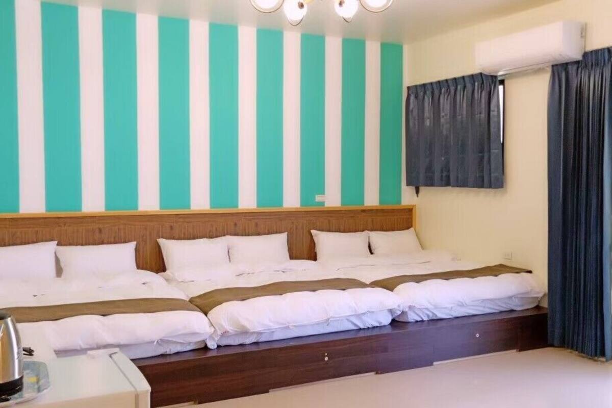 Family Room | Down comforters, blackout drapes, free WiFi, bed sheets
