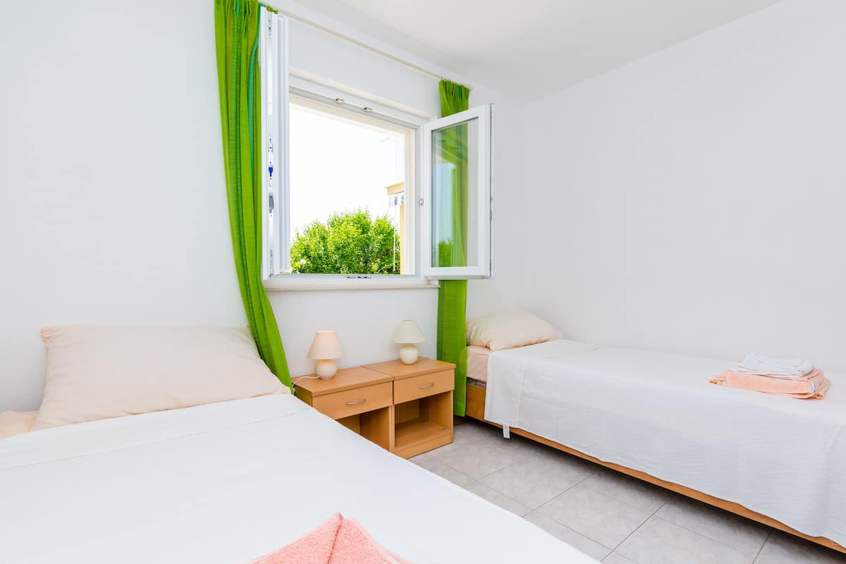 Twin Room, Patio, Garden View | Individually decorated, individually furnished, free WiFi, bed sheets