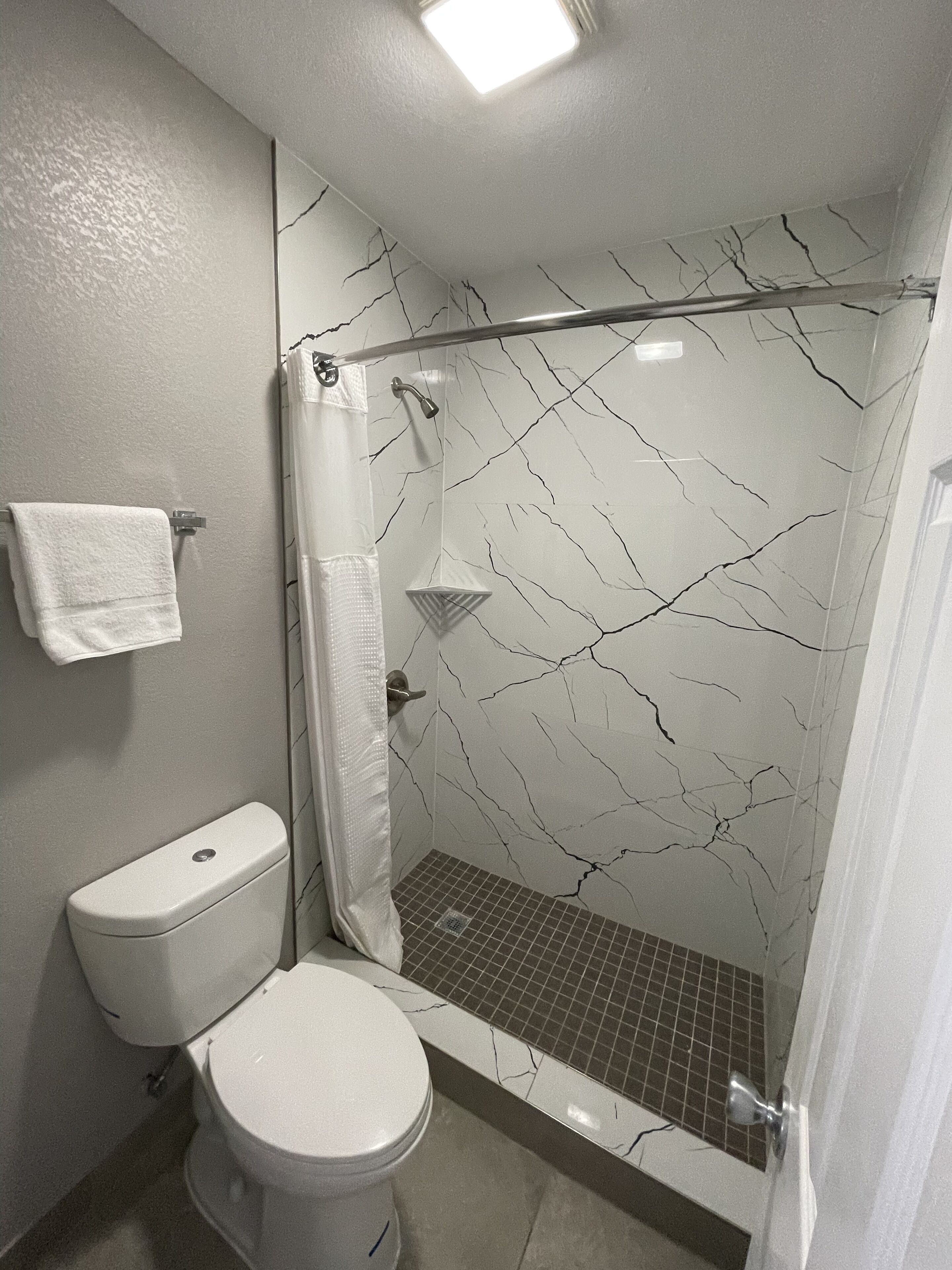 shower, free toiletries, hair dryer, towels