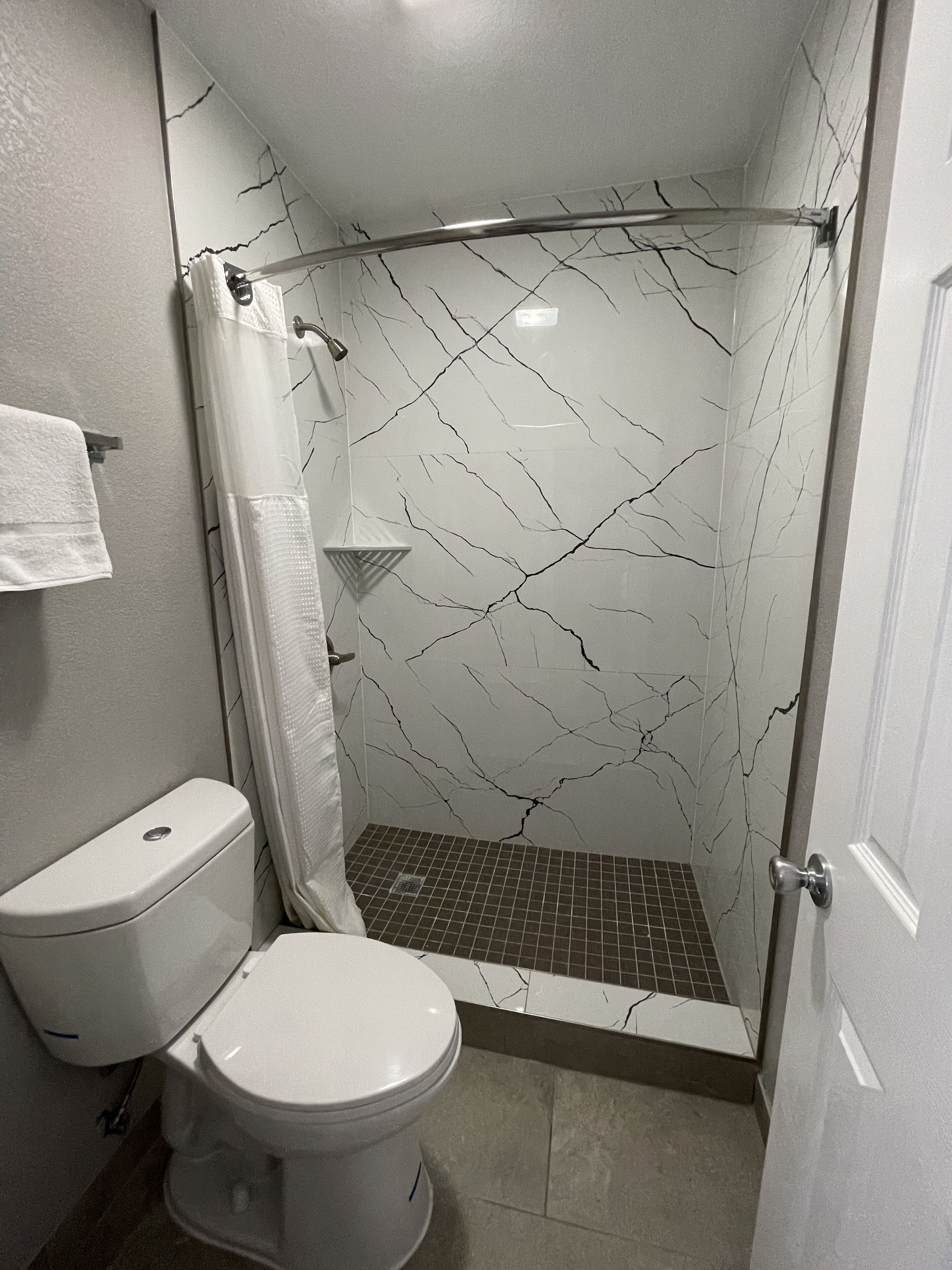 shower, free toiletries, hair dryer, towels