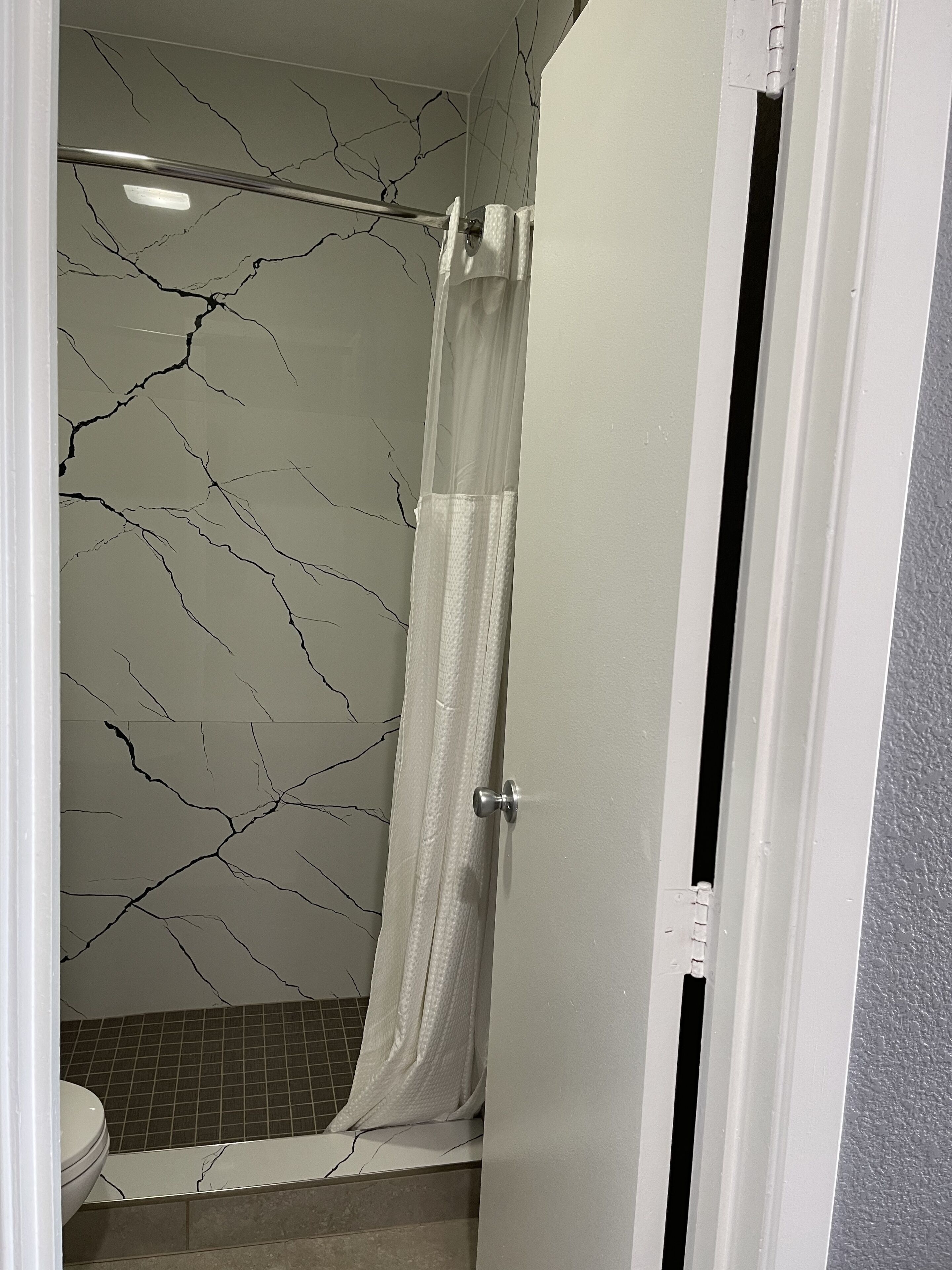 shower, free toiletries, hair dryer, towels