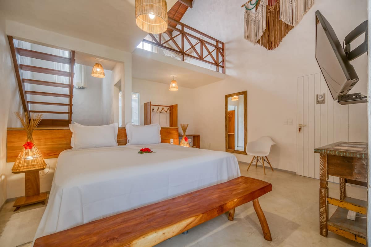 Suite Loft Vista Parcial Mar com Ofuro | 미니바, 다리미/다리미판, 무료 WiFi, 침대 시트