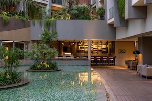 Outdoor pool, open 7:00 AM to 7:00 PM, pool umbrellas, sun loungers