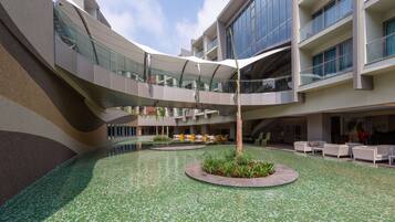 Outdoor pool, open 7:00 AM to 7:00 PM, pool umbrellas, sun loungers