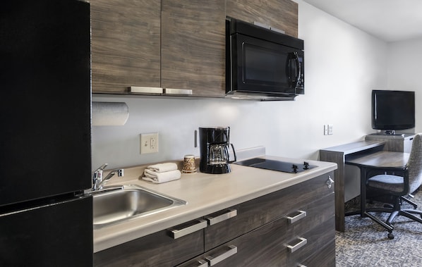 Full-size fridge, microwave, stovetop, coffee/tea maker