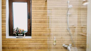 Deluxe Apartment, 1 Queen Bed, Terrace, City View | Bathroom | Shower, rainfall showerhead, free toiletries, hair dryer