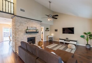 Smart TV, fireplace, books