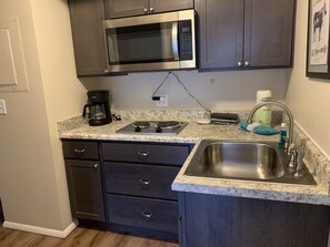 Fridge, microwave, stovetop, coffee/tea maker
