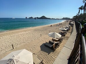 On the beach, sun-loungers, beach towels