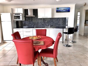 Panoramic Apartment | Private kitchen | Full-size fridge, microwave, oven, stovetop