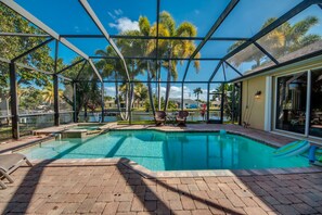 Outdoor pool, a heated pool - Breezy Palm, Family Friendly Home On The Water-Heated Elec Pool-Spa, WIFI (CapeCoral)
