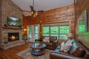TV, fireplace - Creekside Bliss | 2BR Cabin • Walk to Downtown • Patio + Fireplace + WIFI (Gatlinburg)