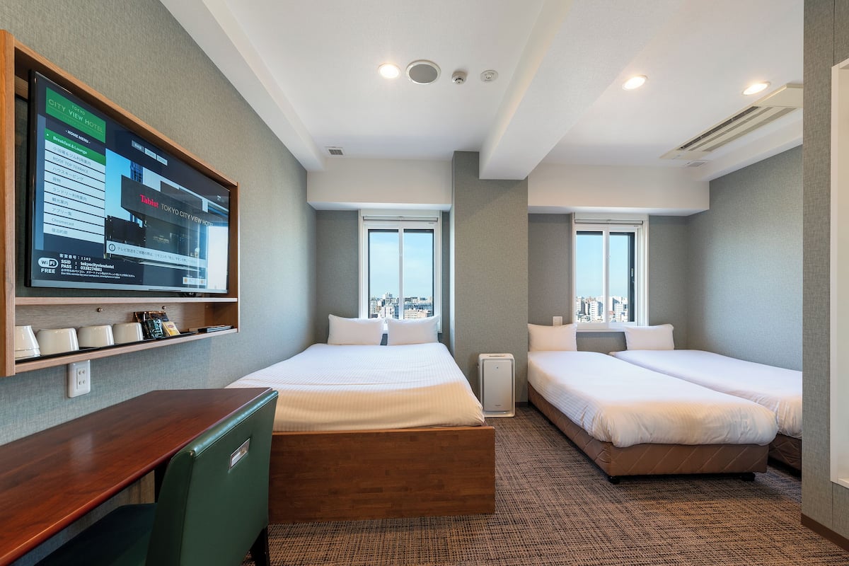 Triple Room, City View | Down comforters, in-room safe, desk, free WiFi