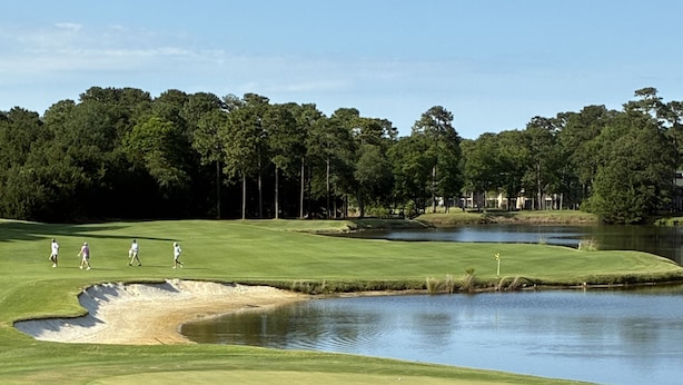 A golf course with a water hazard, sand bunkers, and a putting green. - 1st Floor! Corner Unit! 3 Bedrooms! True Blue Golf Course, Minutes from Beach! (Pawleys Island)