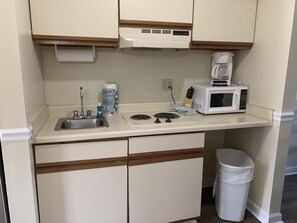 Fridge, microwave, stovetop, coffee/tea maker