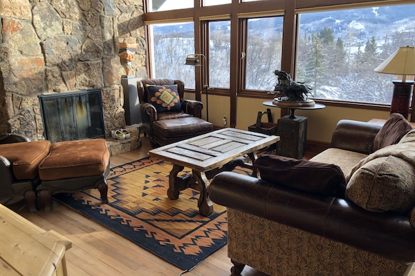 Living Room With Mountain Views and Fireplace
